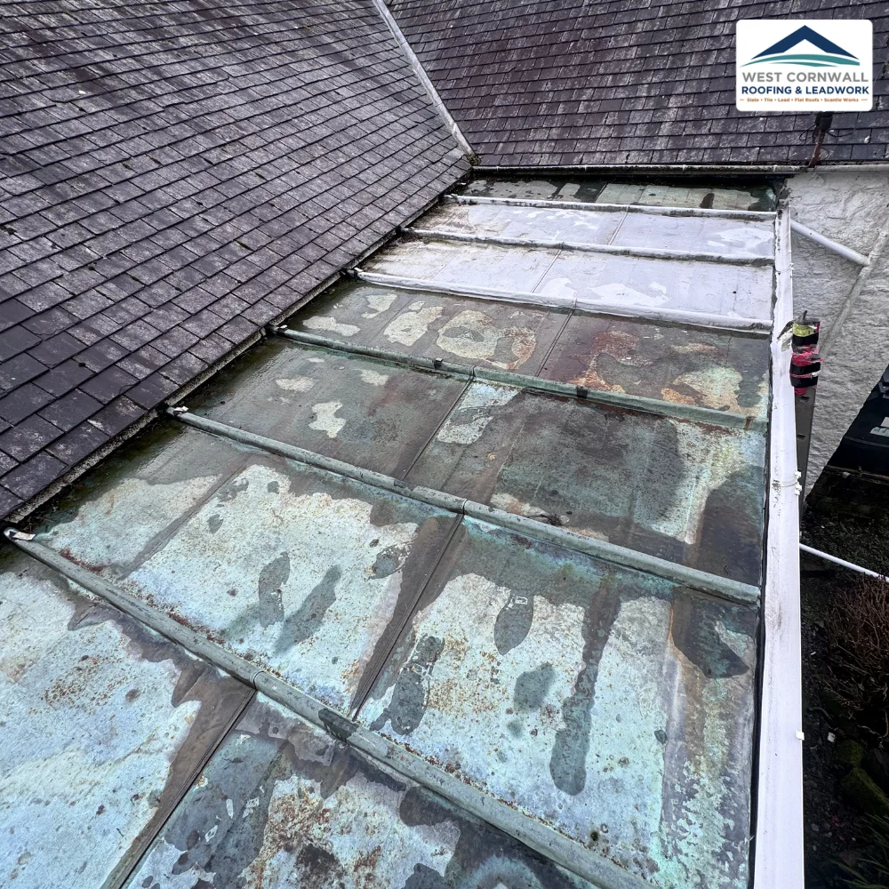 Worn lead flat roof, before