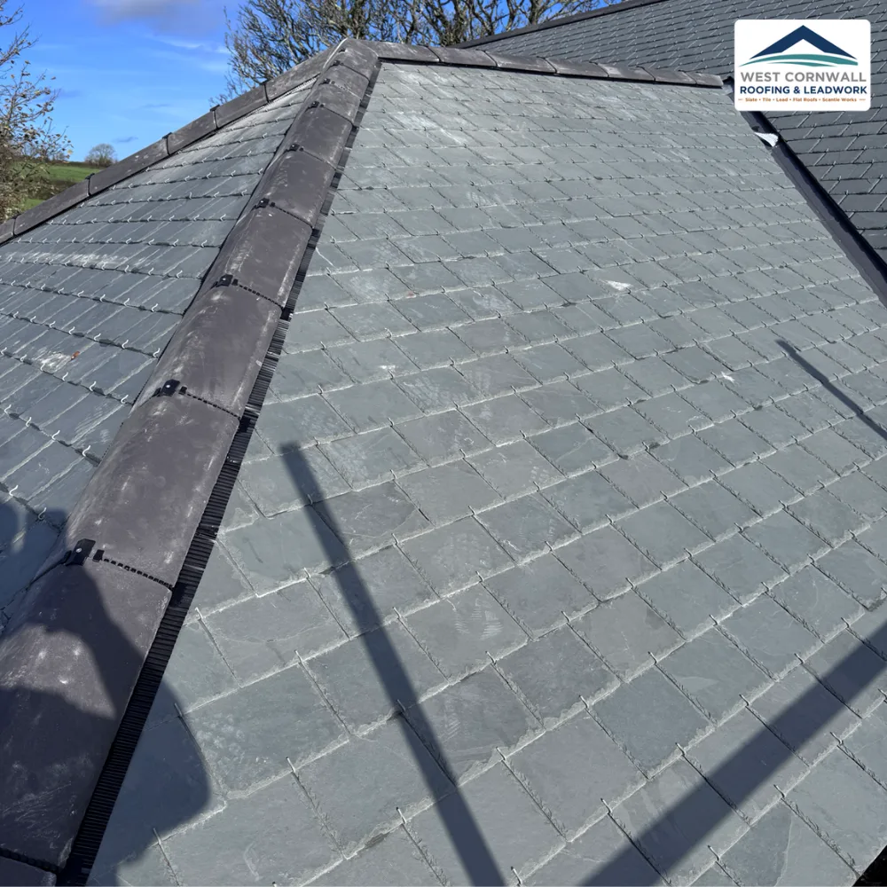 Large hipped roof in natural slate